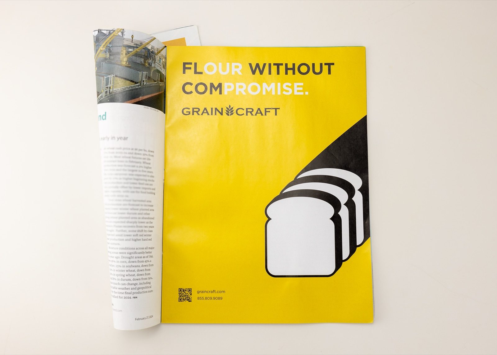 The Grain Craft 'Flour Without Compromise' advert on a rolled magazine page